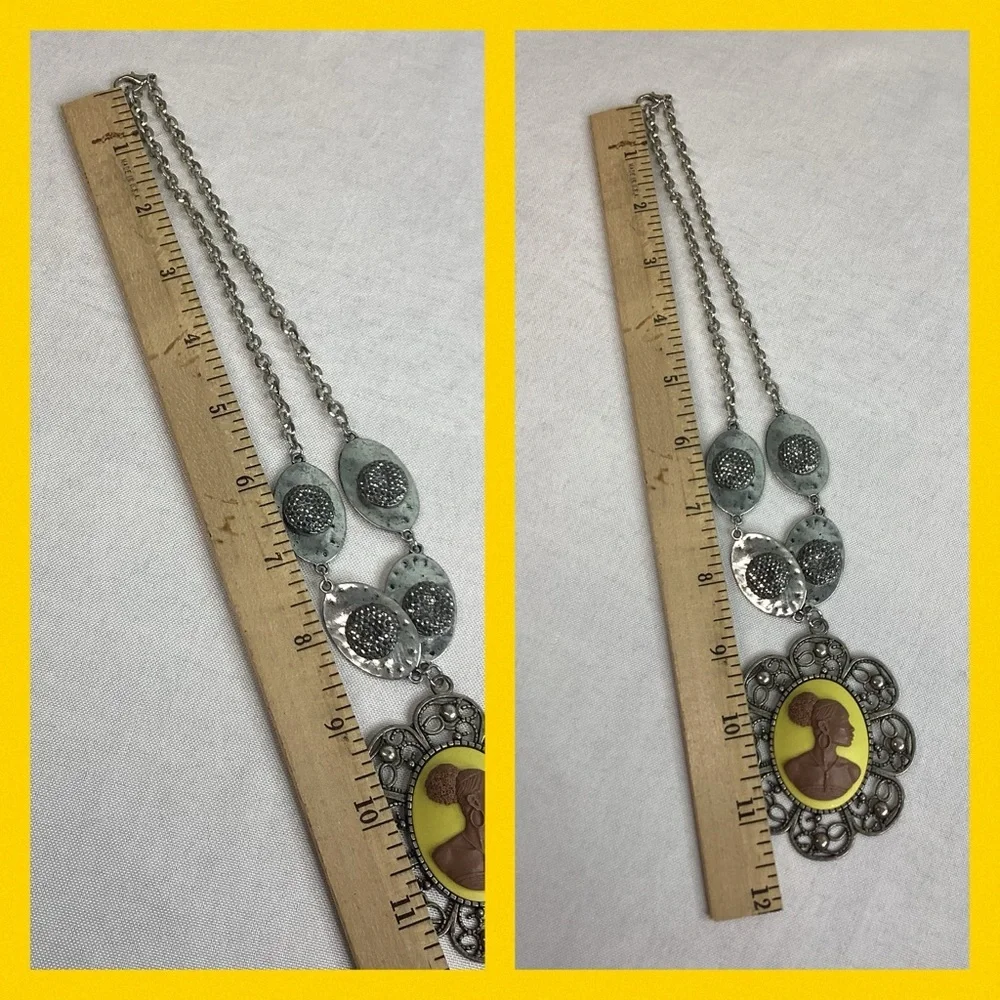 Yellow and silver cameo necklace.